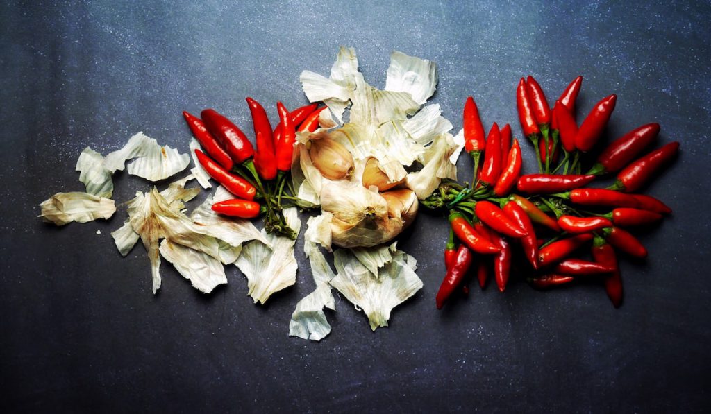 Garlic And Chili Peppers on black background